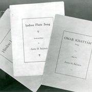 Three pieces of sheet music written and published by Anita Baldwin are pictured.  Two titles clearly seen are: Indian Flute Song and Omar Khayyam.