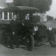 Carl Ettensperger standing by milk delivery truck owned by the Mountain View Dairy, Arcadia.  This photo was on a Monrovia street.  Dairy was located on Jeffries Street. (However, 1924 City Directory says Mountain View Dairy was at Valnett Ave sw corner 6th Ave.)
