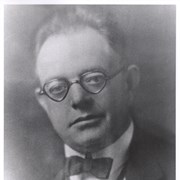 Portrait of former Arcadia mayor John M. Walshe.  He is shown in formal dress with a bow tie.  He is wearing glasses.  John M. Walshe was born in New York in 1877 and died in Arcadia in March, 1935.  He was mayor in 1930-31.