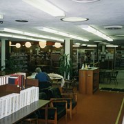 Phase I of Library Renovation/Expansion Project at 20 W. Duarte Road.  This view was taken in the adult reading room, looking toward the circulation desk.  A patron is sitting with his/her back to us. Globe lights.