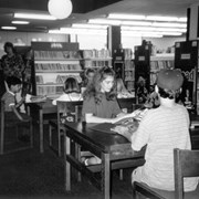 Children seated at a table in the Children's Room at Arcadia Public Library, 20 W. Duarte Road.  This was taken shortly before remodel/expansion project. The children are all children of staff members.