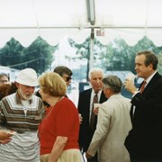 Groundbreaking ceremonies for the remodel/expansion project at Arcadia Public Library, 20 W. Duarte Road.  A number of people are standing under the white tent.  At the extreme left is Betty Rochefort.  Standing next to her with the white hat is John Reuter.