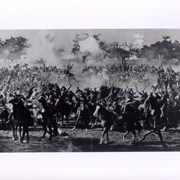 Photographic reproduction of full two-page spread appearing in the February 28, 1938 issue of Life Magazine.  Photo shows men on horses with swords, appearing to be fighting a battle.  Caption indicates it was taken during filming of the movie OF HUMAN HEARTS. Information found with the original indicates that the filming took place at the Arboretum.