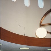 Damage to the Arcadia Public Library as a result of the Whittier Narrows earthquake.  The earthquake measured 5.9 on the richter scale. This photo shows damage to the tower in the front circulation area. Wagon wheel light fixture.