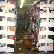 Damage to the Arcadia Public Library as a result of the Whittier Narrows earthquake.  The earthquake measured 5.9 on the richter scale. This photo was taken in the adult nonfiction stacks.