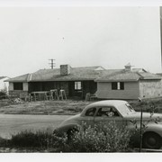 Home at 1050 Paloma Drive is under construction.  There is a car parked across the street.  This home was built and owned by the Charles Francis Earl family.  Construction began in late 1951, completed in early 1952.  See also photo #1633.