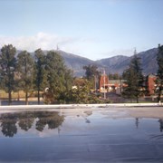 Water damage to the Arcadia Public Library resulting from rain.  This view is of standing water on the roof.  The San Gabriel Mountains are prominent in the background.