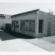 Unknown buisiness building at 34 or 36 E. Foothill Blvd.  In 1948 City Directory, #34 is listed as H. & H. Auto Service. Also shown is Red Spot Liquors.