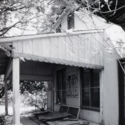 Exterior of mansion, showing relief sculpture of three standing figures, on the south side of the house, possibly a covered side porch. Former home of Prince Erik of Denmark in 1920s at 2607 S. Santa Anita Avenue. Built in 1924. Property now owned by Arcadia Congregational Church. Photograph by Terry Miller. See also ID 2189 and 2191.