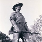 Statue of a soldier at Arcadia County Park. He is standing, wearing boots and hat, belt of ammunition, canteen across his body, holding a rifle. It is known as "The Hiker," one of 52 casts of the Spanish American War Memorial made between 1921 and 1956 to commemorate the 1898 Spanish American War. Photograph by Terry Miller.