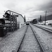 Front view of abandoned caboose of a train. Train is marked with Pine Bluff SP 151 (clearer in photo 2258A). Looking west on train tracks near First Avenue, between Santa Clara Street and Saint Joseph Street in Arcadia, California. Photo by Terry Miller.