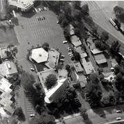 Aerial view, of the white A-Frame roof of Santa Anita Church (address is 226 West Colorado Boulevard, Arcadia, California). A six-sided, hexagon building near Santa Anita Church is the Fireside Room and Fellowship Hall, which is part of the Santa Anita Church. The church property goes all the way to Colorado Place (including "The Village Apartments," formerly the Frontier Motel, which the church purchased in 1972) and includes the parking lot and the building at the top of the photo, the Margaret Stevens Center. Any use of this image must be credited "Photograph by David Stevens. Copyright David Stevens."