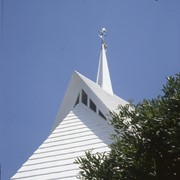 Exterior of Santa Anita Church, address 226 West Colorado Boulevard, showing white A-frame roof, as also seen from the aerial photos by David Stevens, and ornament above the white point. Any use of this image must be credited "Photograph by David Stevens. Copyright David Stevens."