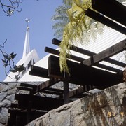 Exterior of Santa Anita Church, address 226 West Colorado Boulevard, showing white A-frame roof, as also seen from the aerial photos by David Stevens, and ornament above the white point. Dark beams jutting out and stone walls. Any use of this image must be credited "Photograph by David Stevens. Copyright David Stevens."