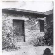 Stone house at 58 W. Grandview.  Small girl in foreground possibly Dextra Baldwin.  Anita Baldwin purchased 22 acres of her father's land for $10.00 on March 8, 1892. (see Arcadia VF-Baldwin, Anita) Anita's father built stone cottage in May 1902 on lot 7 and part of lots 8&9 in block 98 of Santa Anita Tract. (This information came from Mrs. Sharlene Cartier, who owned the house in 1973.)