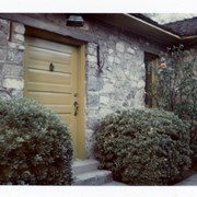 The stone house at 58 W. Grandview.  Shows yellow-gold front door.  See information for photo #251 for complete detail.