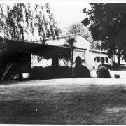 View looking northwest across lawn to front of Arcadia Public Library, 25 N. First Avenue.  Spanish style building was completed in 1930 and used until new library was built at 20 W. Duarte Road in 1961.