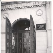 Close-up photo of front entrance of Arcadia Public Library, 25 N. First Avenue.  Shows handsome double doors.