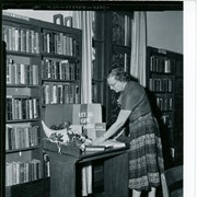 Judith Boegerhausen (later became Mrs. Al Moore) arranging Thanksgiving display at Arcadia Public Library, 25 N. First Avenue.