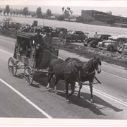 Stage Coach pulled by two horses on Huntington Drive near the Club House as part of Peach Blossom Parade.  Stage coach has printed on it: ARROWROCK STAGE LINE.
