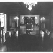 View from east end of dining room of Anoakia, looking west through front entry toward library.  Note Tiffany light fixtures.