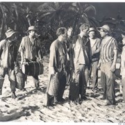 Actor George Lloyd on sand in a still from Devil's Island, a movie shot at Arboretum.