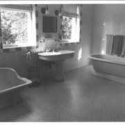 Master bathroom at Anoakia.  White tile, bathtub and bidet.