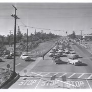 View west on Huntington Drive from above intersection with Baldwin during rush hour race traffic coming to track. Note Pacific Electric Tracks have been removed but right-of-way has not been reworked.