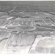 In this aerial view looking toward the east, the oval directly in the center of photo was a training track belonging to Santa Anita.  This was removed to make room for the Fashion Park mall.  The small circular track across what is now Baldwin Avenue and the oval track farther south belonged to a private riding stable.  The remains of the Los Angeles Jockey Club Track which Joe Smoot and Anita Baldwin started but did not complete in 1933, can be seen in lower right corner. This photo belongs to the Huntington Library. It is shown here for research only.