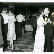Group of people dancing at Diamond Jubilee Ball.  The couple shown at right of photo are the only ones identified.  They are Mr. and Mrs. Ernest Russell.