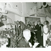 Photo is similar to #747.  Mr. Jim Helms is shown at microphone while awarding Chairmen. Those clearly in view are: Carla Maggio (white dress); and, Jean Cope at extreme right.