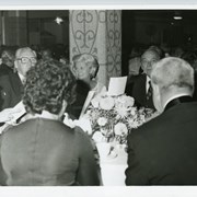One of groups pictured at table at Diamond Jubilee Ball includes Lyle Alberg (Arcadia City Manager) with glasses facing camera.  Next to him is an unidentified lady and on right,looking at camera is Elb Souders, Assoc. Superintendent of schools for Arcadia.