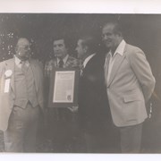 Shown holding plaque with copy of Congressional Record are, L-R: Councilman Charles Gilb; Mayor David Parry; Congressman John Rousselot; and Sheriff Peter Pitchess.