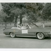 Convertible driven in Diamond Jubilee Parade carries Superintendent of Schools for Arcadia Dr. Ed Ryan and his wife, Ruth.  Others in car not identified.