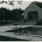 View across pool at home then owned by Dr. Alva Surber at 1014 Hampton Road.  There are broad stairs leading to a covered sitting area that can look out to pool and tennis court on a slightly higher level.