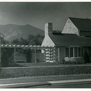 View toward mountains from pool area of home of Dr. Alva Surber at 1014 Hampton Road.  House is seen connected to covered sitting area by trellised walk.