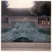 Bas relief sculpture above decorative pond and fountain at stairs leading to entry at Anoakia.