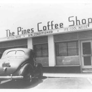View taken approximately 20 feet from front door of the Pines Coffee Shop. It was located at the Drive-In Market area at SW corner of Huntington and First Ave.  It was the place of business closest to Huntington Drive.  Otto Petersen bought it in 1929, according to Lorraine Petersen, Daughter-in-law. It had previously been called Odette's.  (see photo #435)