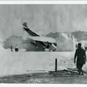 Scene shows airplane crashed into "snow" with about 14 motion picture company employees nearby.  Printed on side of plane is: PIERCE+RONDELLE ANTARCTIC EXPEDITION.  This was at Arcadia County Park area and according to Ray Ramuz at Arcadia Nursery who was a small boy at the time, "snow" was bleached corn flakes.