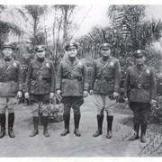Five police officers are seen standing for their picture.  L-R: Don Ott, Harry Peterson, Louis Jack Richards, Grady Pardue, and Capt. James B. Stine.  They are in full uniform.